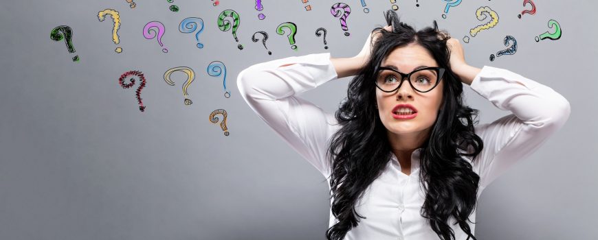 Question Marks with woman feeling stressed